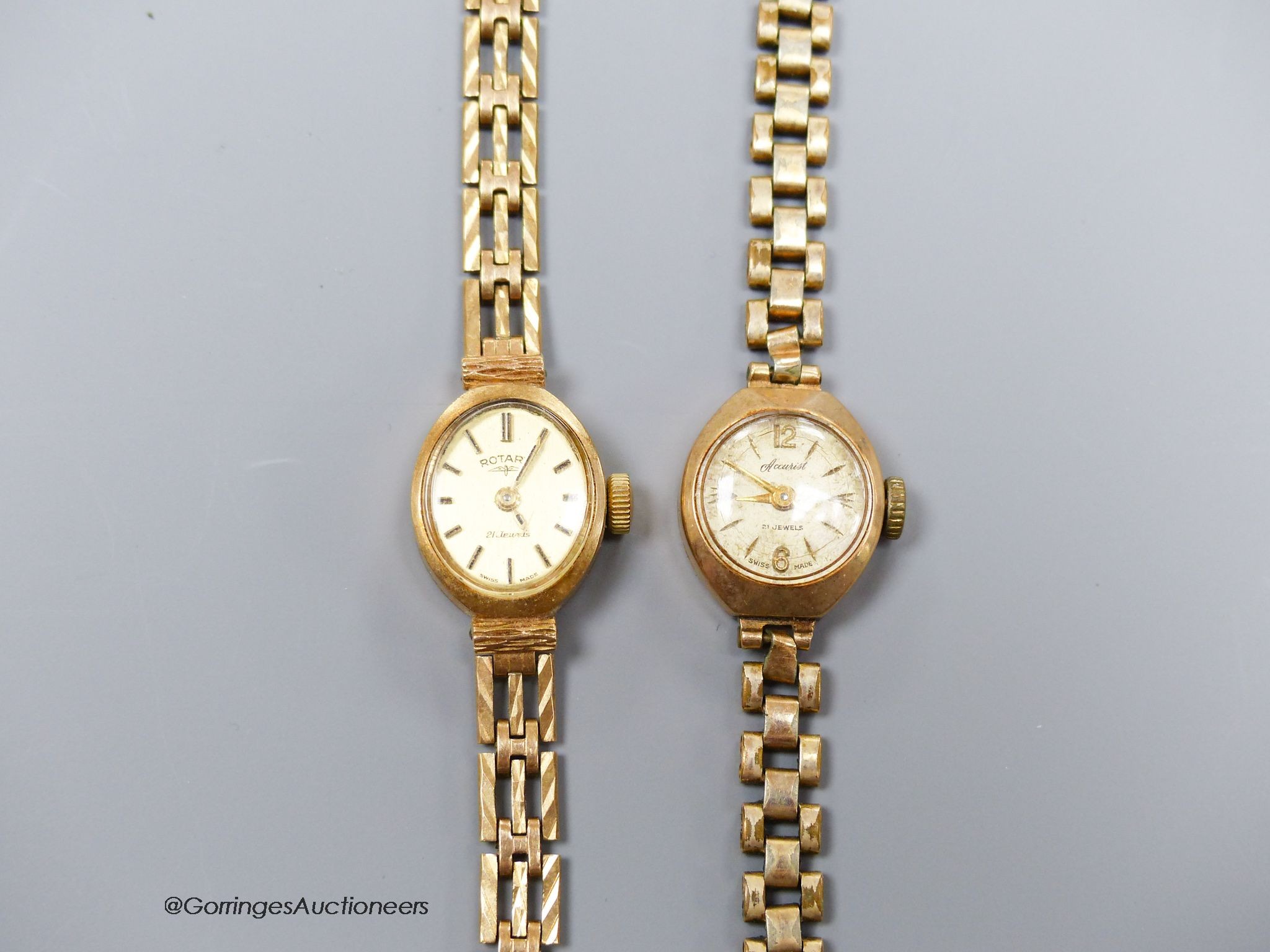 A ladies' 9ct gold-cased wristwatch on 9ct gold bracelet and another similar watch on gilt metal bracelet
